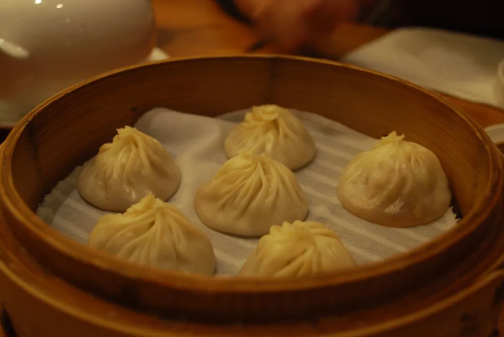 Steamed xiaolongbao soup dumplings in a basket